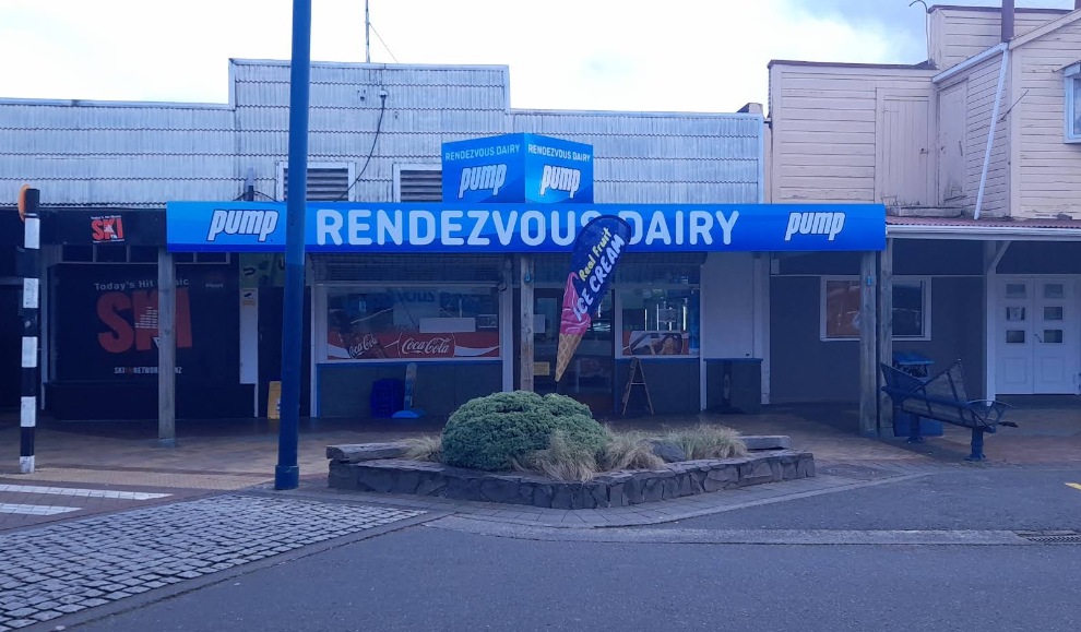 Rendezvous Dairy storefront with its blue sign in Ohakune